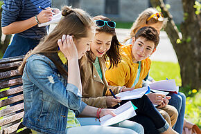 group of students with notebooks at school yard